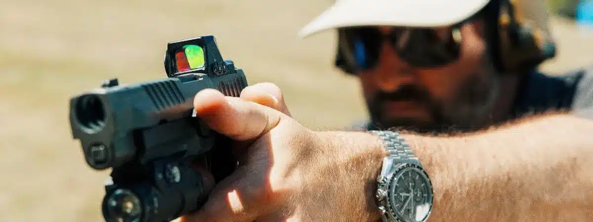 SigRedDotShooter Person aiming a Pistol with a Red Dot Sight
